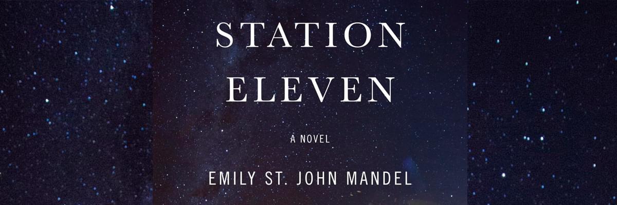 The text 'Station Eleven, A Novel, Emily St John Mandel' is in white font in the middle of the image, with a dark blue and starry background