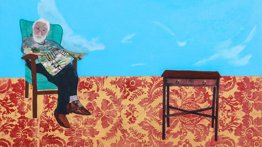 Painting of an older man sitting in an old armchair, holding a travel magazine. The background is spilt between a bright blue sky at the top and a large red and dull yellow floral pattern at the bottom to represent carpet.